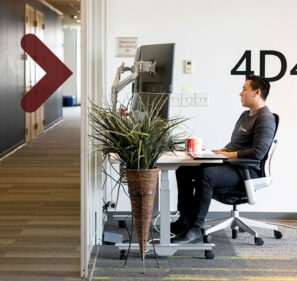 Man at his work station in an office