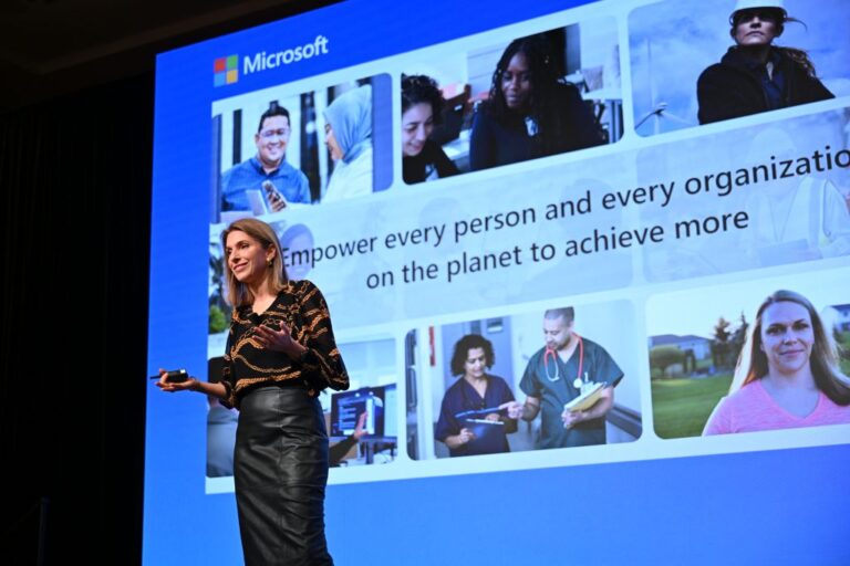 A woman giving a presentation on stage