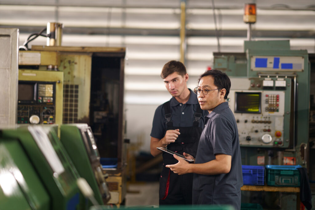 Two men at a factory